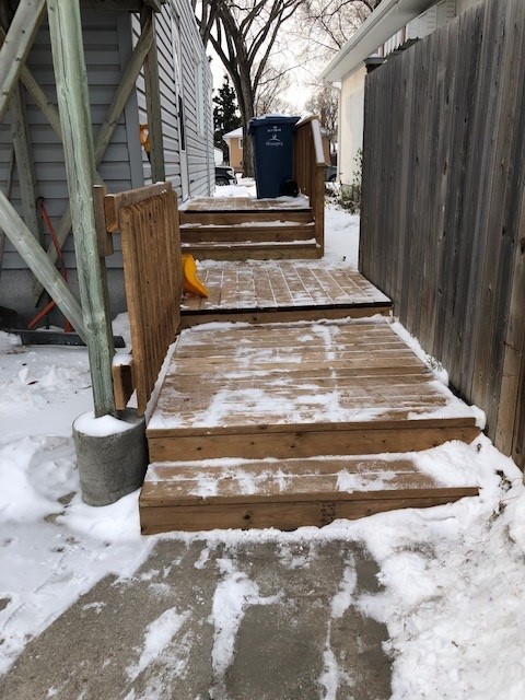 A newly rebuilt wooden deck on the side of the Enniskillen residence in Winnipeg
