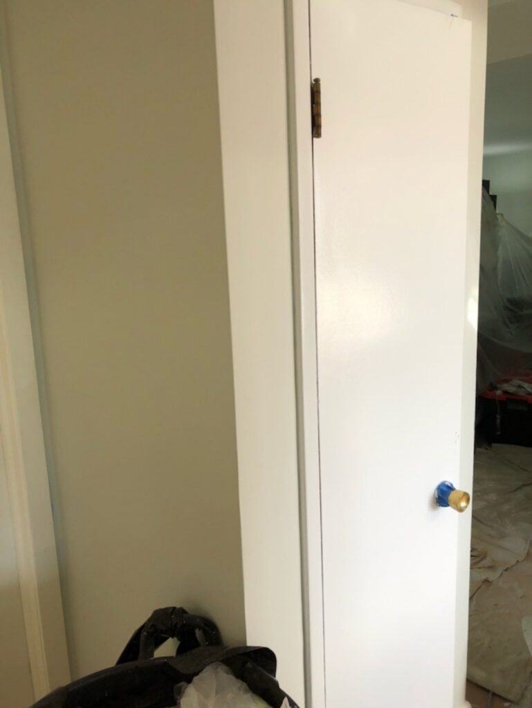 A freshly painted white door